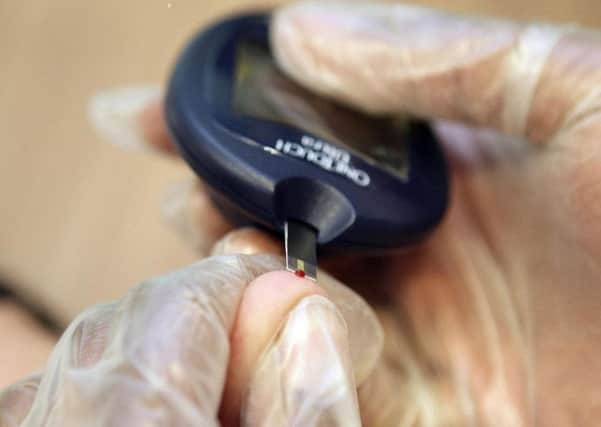 A patient undergoing a blood sugar test for diabetes as the number of amputations carried out due to diabetes has reached an all-time high of 135 a week.