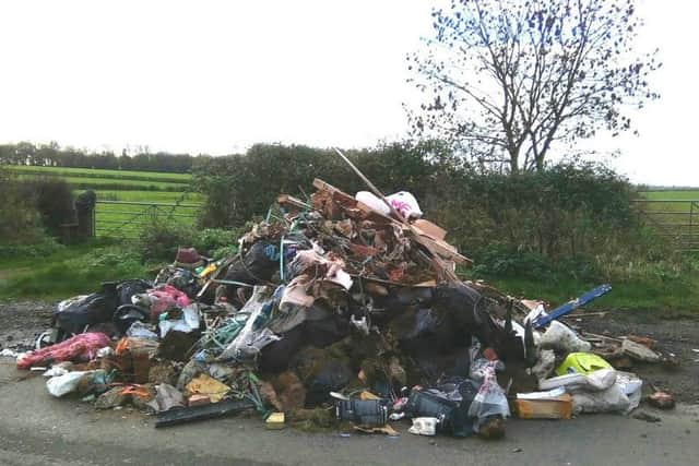 A huge pile of household and building waste was discovered dumped in Little Lawford Lane NNL-151117-130307001