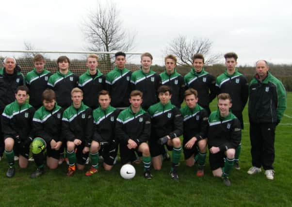 Melton Foxes Under 17s in kit and raintops supplied by sponsors BAC Electrical (Melton) and PlanitX Town and Country Planning Services EMN-151222-123708002