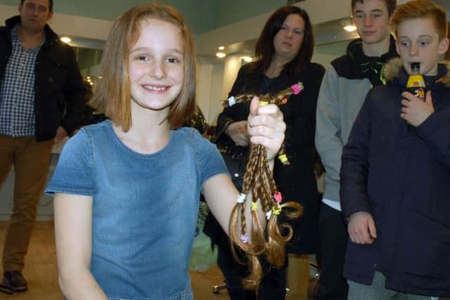 Matilda with family and friends after her charity hair cut