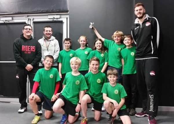 Frisby School team with Harrison Gamble (right) and community coach Mark Edwards EMN-161201-181519002