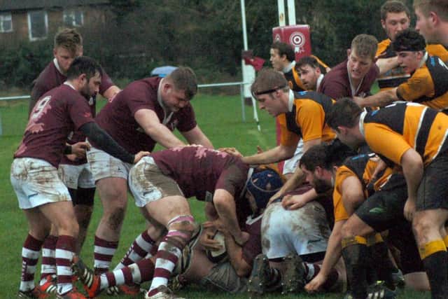 Melton try to break through massed ranks on the Oakham try line EMN-161201-103811002