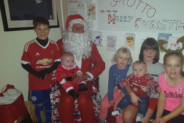 The juniors pay a visit to Santa in his grotto
PHOTO: Supplied
