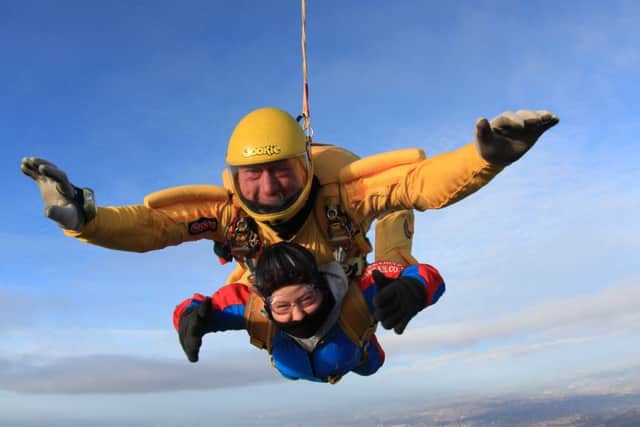 Teresa Phizacklea (53), with her tandem partner for the charity parachute jump which raised around £800 for Rainbows Children's Hospice
PHOTO: Supplied