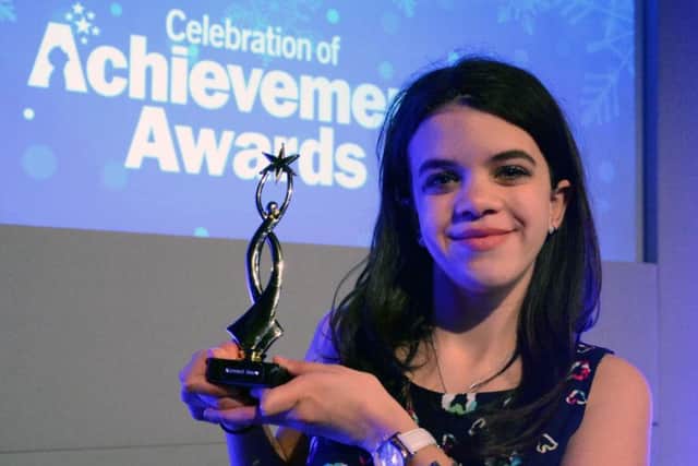 Alannah, 15, with her award EMN-160126-125553001