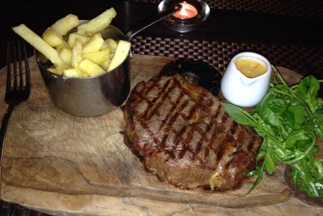 Rib-eye steak with hand-cut chips, rocket salad and Long Clawson Blue Stilton Cheese sauce
PHOTO: John Mason