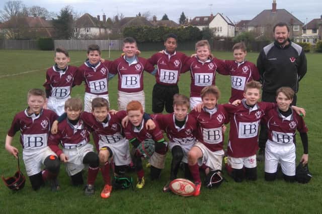 Melton RFC Under 12s proudly display their shirts sponsored by HB Shoes, Topps Tiles and John Smiths Pine EMN-160126-115254002