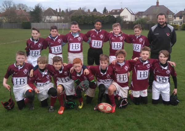 Melton RFC Under 12s proudly display their shirts sponsored by HB Shoes, Topps Tiles and John Smiths Pine EMN-160126-115254002