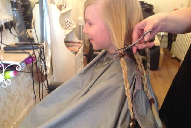 Rose Hardiman (9), gets a haircut for the Little Princess Trust