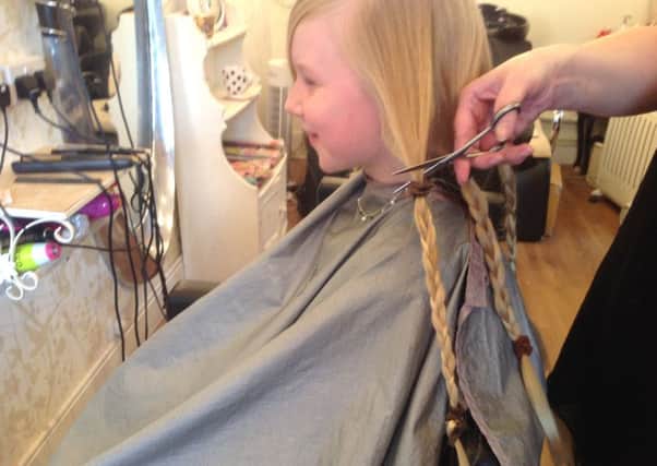 Rose Hardiman (9), gets a haircut for the Little Princess Trust