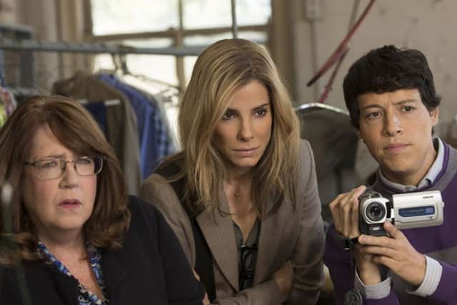 Reynaldo Pacheco, Dominic Flores, Sandra Bullock and Ann Dowd PHOTO: PA Photo/Patti Perret/Warner Bros