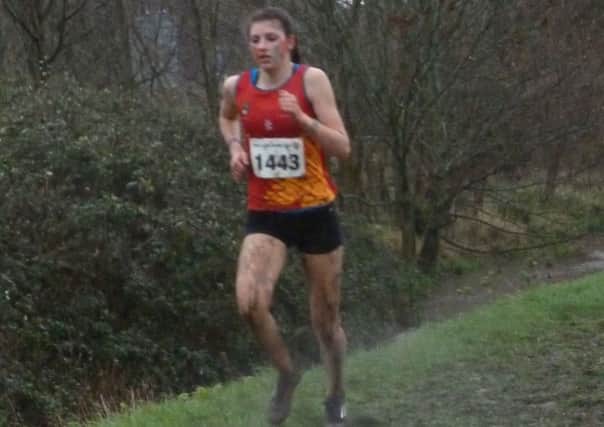 Mari Smith powers through the mud at the British Universities Cross Country Championships EMN-160902-120739002