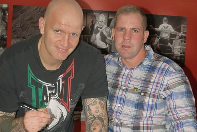 Melton professional heavyweight Paul Butlin signs for well respected boxing manager Carl Greaves PHOTO: Tim Williams EMN-161002-110821002