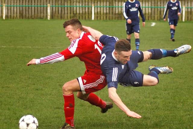Levi Fray shields the ball for Melton EMN-160216-151052002