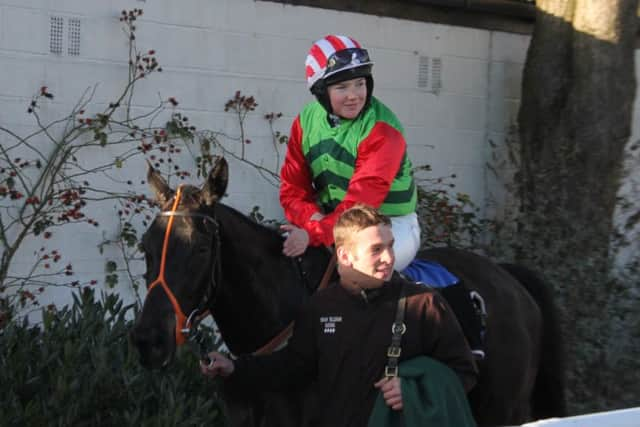 A delighted Megan Carberry returns to the winners' enclosure after her first hurdle win under National Hunt rules on Point the Way. EMN-161002-172055002