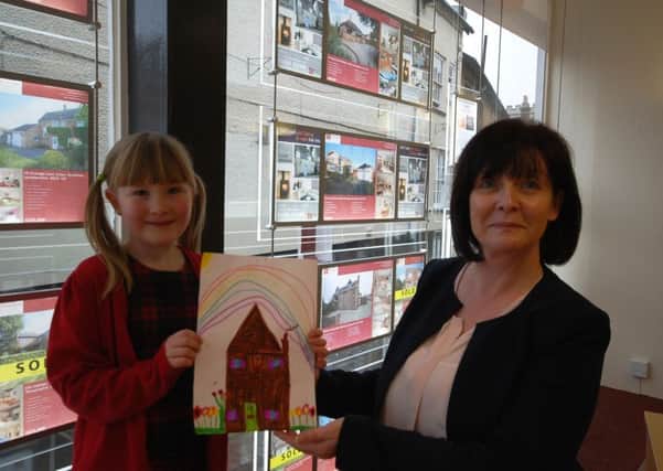 Competition entrant Zahra Hicks, of Whissedine Primary School, with Nicola McKenzie of Richard Watkinson and Partners 
PHOTO: Supplied