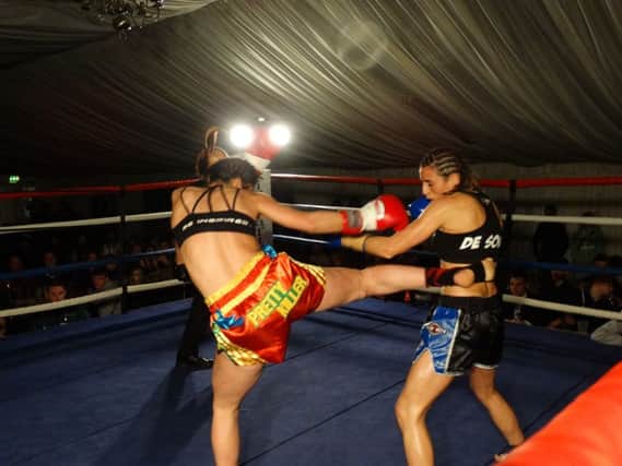 Iman lands a body kick during her entertaining points win EMN-160223-192006002