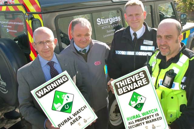 Pictured from left with some of the Rural Watch signs are Stephen Jeal, Melton NFU Mutual senior group secretary, Hugh Brown, cheif executive officer of Gillstream Markets Ltd which manages Melton Market, Leicestershire Police deputy chief constable Roger Bannister and Pc Mark Longden, dedicated neighbourhood officer covering the Vale of Belvoir EMN-160223-175011001