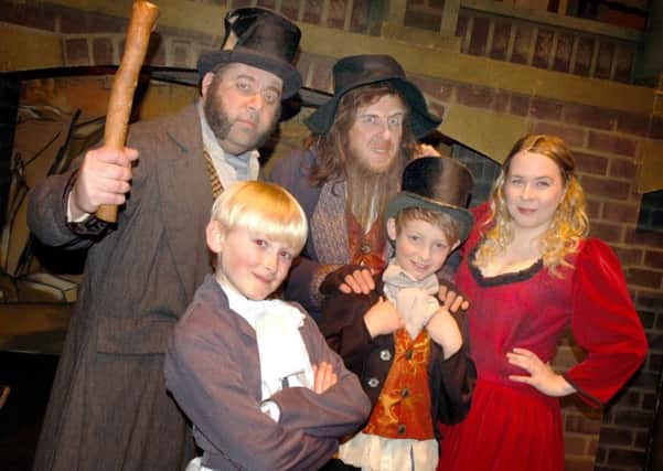 Oliver (Aidan Devlin) with fellow lead characters Bill Sykes, Fagin, Artful Dodger and Nancy 
PHOTO: Tim Williams