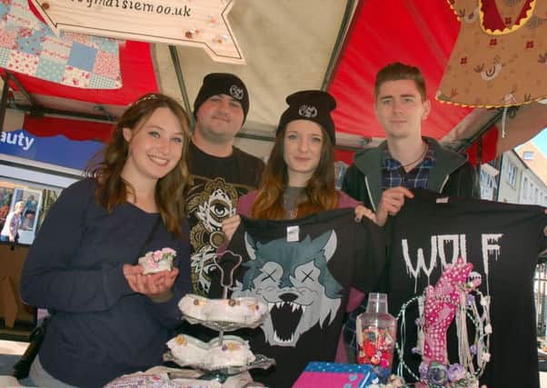 Pictured here at Melton's first Teenage Market held last year (2015) are stallholders Maisie Kennington, from Daisy Maisie Moo hand crafts, and Maxine Howarth, Michael Little and David Joyce, from Wolf City Clothing EMN-160103-152816001