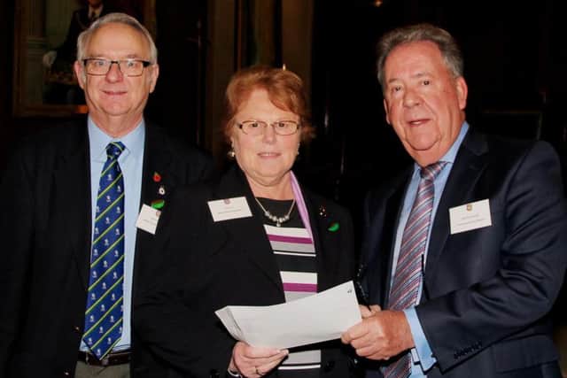 Peter Scott and Ina Scott, of the Melton Community First Responders, with David Hagger, head of the Leicestershire and Rutland Freemasons EMN-160203-103326001