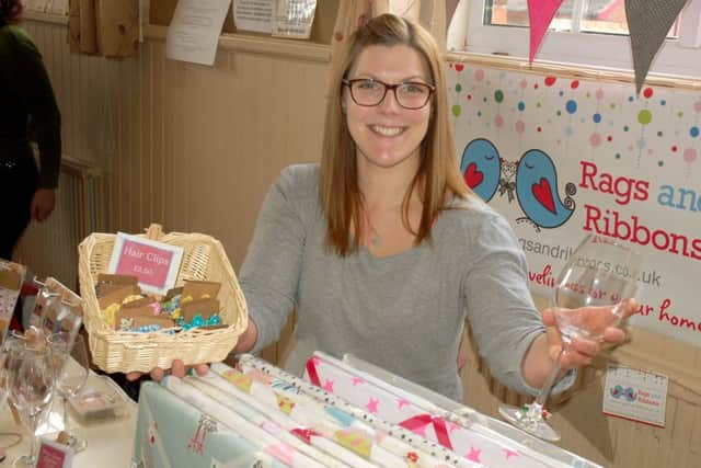 Owner of Rags and Ribbons, Alex North, with some of the crafts and products of her new business 
PHOTO: Tim Williams
