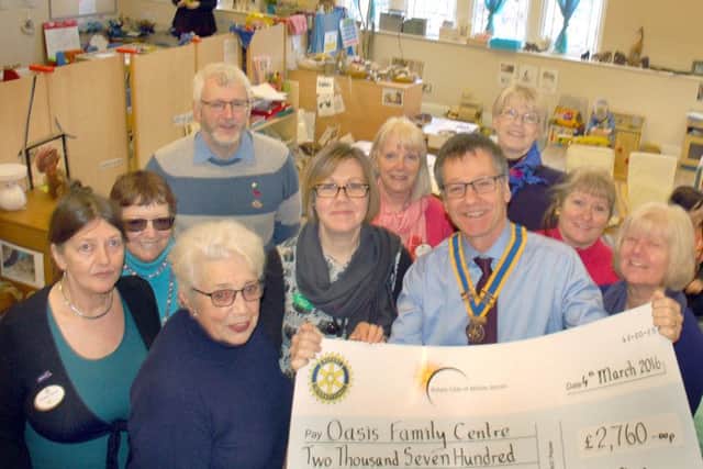 Oasis manager Victoria Conyers accepts the cheque from Aurora Rotary president Brett Culpin and fellow rotarians
PHOTO: Tim Williams