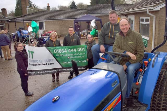 Guest Jonathan Agnew tries out some of the horticultural machinery with Technical Turf managing director Martin Shepherd and staff EMN-160703-132512001