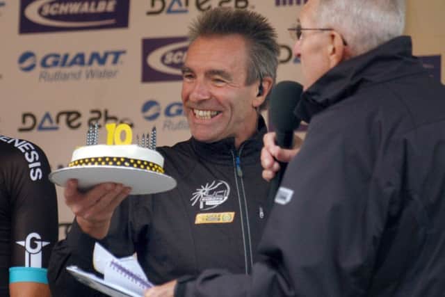 Race director Colin Clews is presented with a cake by race compere Hugh Porter to mark the race's 10th anniversary EMN-160903-144228002