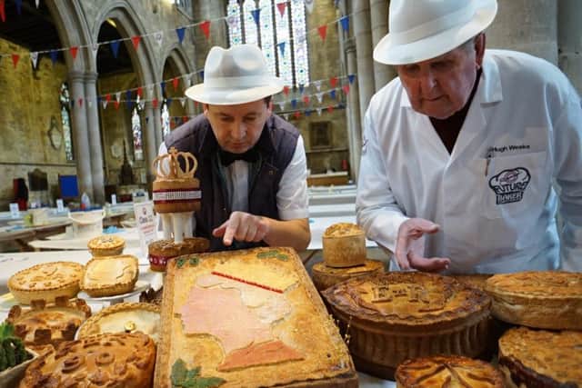 Deputy head judge Hugh Weeks (right) and one of the event organisers Stephen Hallam (left) inspect the entries for this year's Speciality Class: A Pie for the Queen EMN-160314-124545001