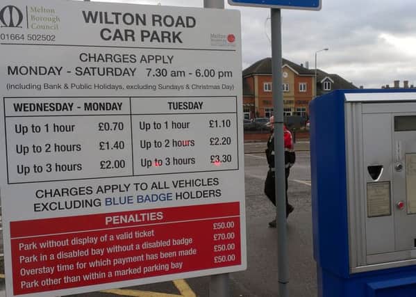 The sign in Melton Council's short stay Wilton Road car park showing its current charges for Monday to Saturday compared to the higher fees on Tuesday EMN-160318-155148001