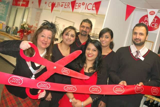 Mayor of Melton Jeanne Douglas officially opens the new Post Office with postmaster Amarjit Singh (right) and his staff. EMN-160317-165807001