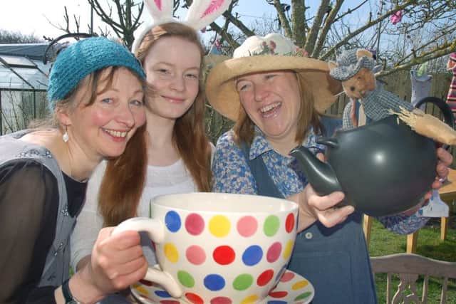 Anna Stasinska, Megan Gooding and Trish Johnston enjoy a large tea in the sock-tree orchard at last year's event
PHOTO: Tim Williams