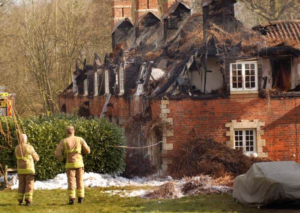 The row of fire-ravaged cottages at Bede Houses, Stapleford Road, Stapleford EMN-160322-115455001