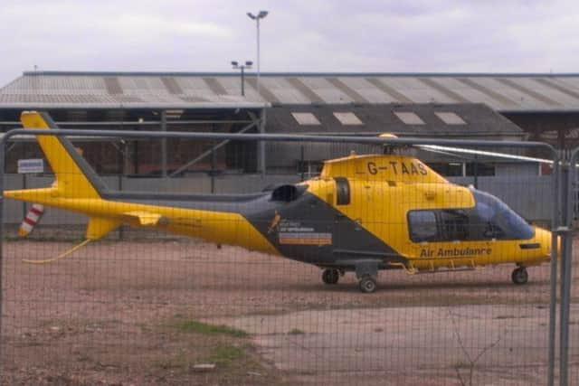 The Derbyshire, Leicestershire and Rutland Air Ambulance prepares to take off from the old abattoir site at Melton Cattle Market EMN-160322-153800001