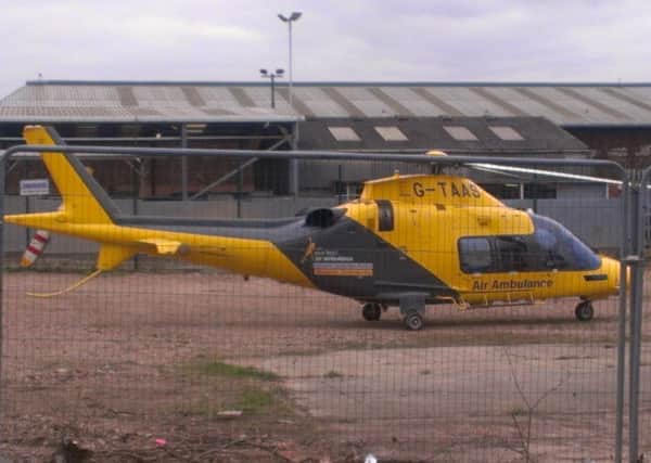 The Derbyshire, Leicestershire and Rutland Air Ambulance prepares to take off from the old abattoir site at Melton Cattle Market EMN-160322-153800001