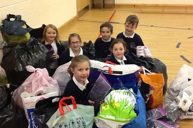 School children at Redmile round up their items to give to Nottinghamshires Refugee Action PHOTO: Supplied