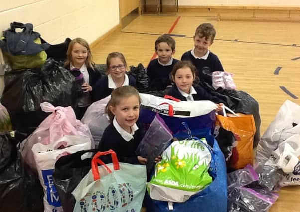 School children at Redmile round up their items to give to Nottinghamshires Refugee Action PHOTO: Supplied