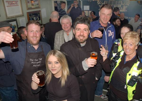 Former Leicester City aces Muzzy Izzet and Steve Walsh raise a glass to the Gas Tap in Melton EMN-161104-130314002