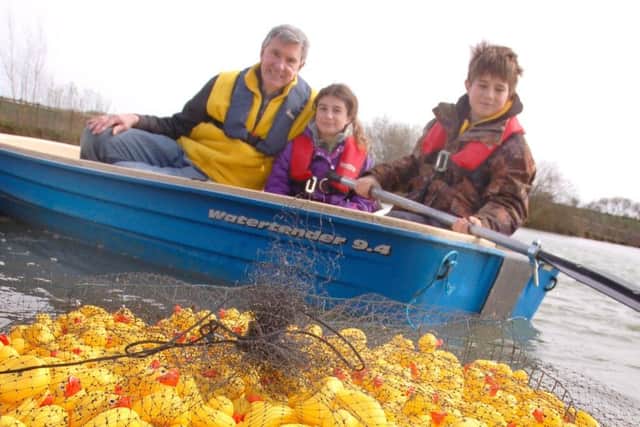 Rotarian David Ward joins Zoe and James Howling in the boat for the duck launch
PHOTO: Tim Williams