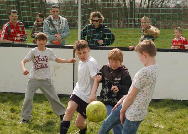 Tense football tournament action between Roy's Krispies and Asfordby Boys 
PHOTO: Tim Williams