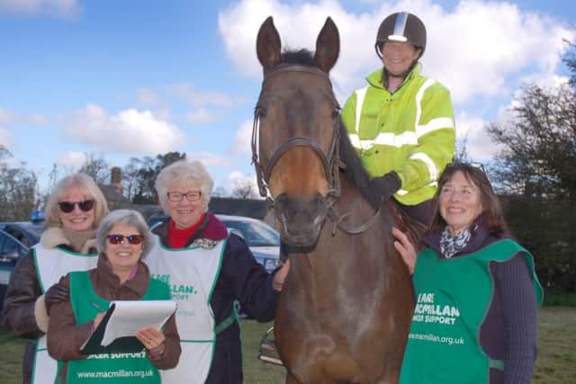 Macmillan organisers and volunteers Nancy Blake, Maria Hopwood, Brenda Greaves and Christine Griffin see rider Jenny Rivett and horse Freya on their way PHOTO: Tim Williams