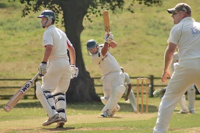 Barkby's Tom Flowers in positive mode against Earl Shilton last season watched by Matt Boyce EMN-160419-173758002
