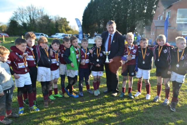 Leicestershire RU representative Brian Hesford presents Melton Under 9s with their trophy EMN-160419-123458002