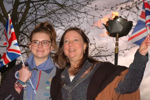Baden Powell badge recipient Jess Seddon, of the 4th Melton Guides unit, and Mayor of Melton Jeanne Douglas celebrate their beacon lighting EMN-160422-111947001