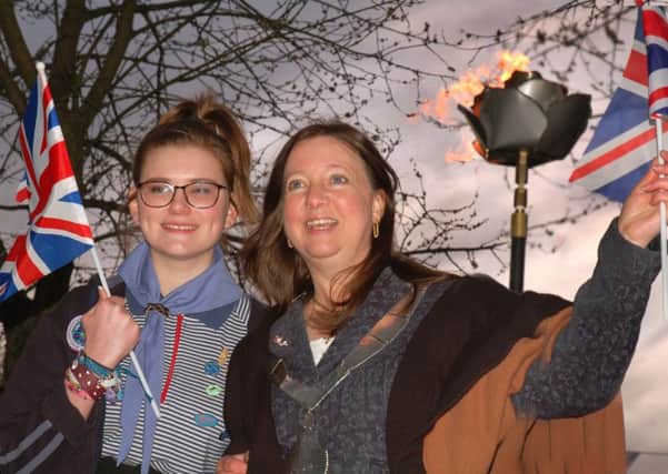 Baden Powell badge recipient Jess Seddon, of the 4th Melton Guides unit, and Mayor of Melton Jeanne Douglas celebrate their beacon lighting EMN-160422-111947001
