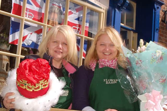 Sallyanne Mousley and Lisa Loveday outside The Flower Basin on Burton Street which was specially decorated to mark The Queen's 90th birthday EMN-160421-172432001