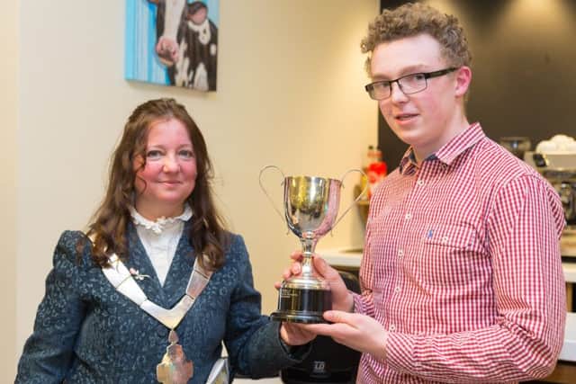 Mayor Jeanne Douglas presents Sam Thompson with the Derek Sanders Cup for the Outstanding Young Citizen Award
PHOTO: Paul Brown