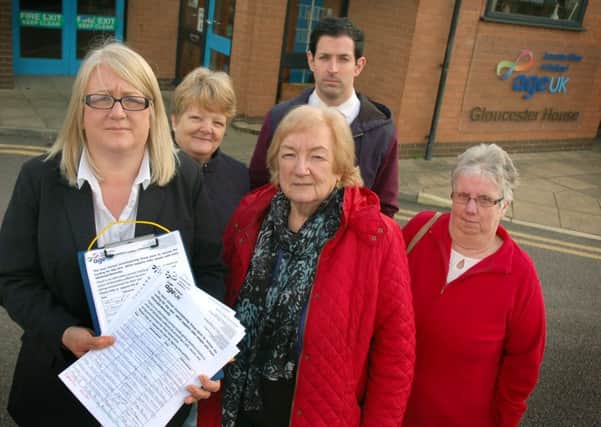 Holding some of the petitions is resource centre manager Rhonda Fazackerley with ward councillors Margaret Glancy, Pam Posnett , Simon Lumley and resident Mary Allen.