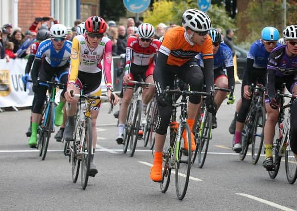 George Sewell (orange top) came home safely in the peloton EMN-160305-115642002
